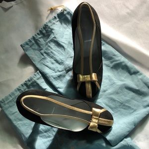 Black suede pump heel with gold bow